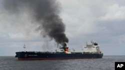 FILE - In this photo provided by the Indian Navy on Jan. 27, 2024, a view of the oil tanker Marlin Luanda burns after an attack in the Gulf of Aden. The Marshall Islands-flagged tanker was hit by a missile launched by Yemen’s Houthi rebels.