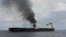 FILE - In this photo provided by the Indian Navy on Jan. 27, 2024, a view of the oil tanker Marlin Luanda burns after an attack in the Gulf of Aden. The Marshall Islands-flagged tanker was hit by a missile launched by Yemen’s Houthi rebels.