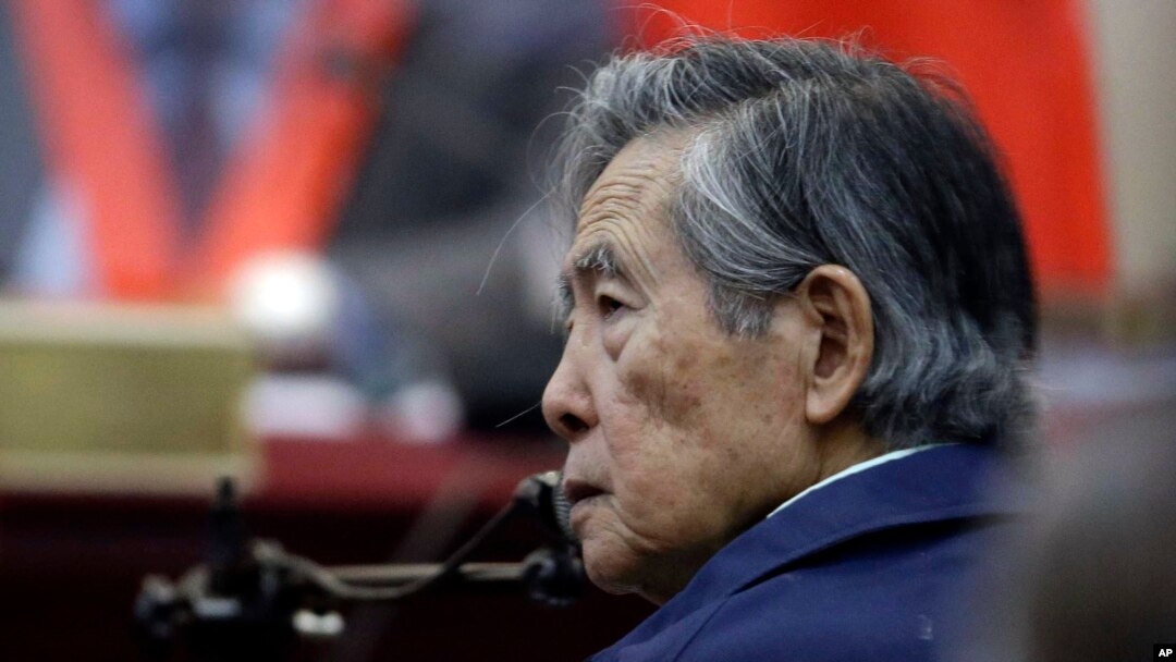 FILE - Peru's former President Alberto Fujimori listens to a question during his testimony in a courtroom at a military base in Callao, Peru, March 15, 2018.
