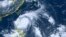 This satellite image taken by Himawari-8, a Japanese weather satellite, and provided by National Institute of Information and Communications Technology, shows Typhoon Doksuri near the northern Philippines, July 25, 2023. 