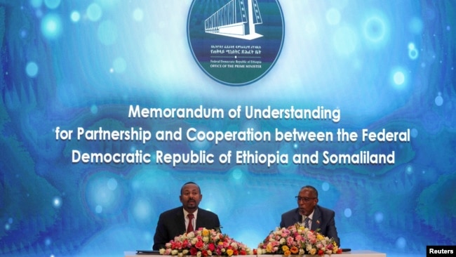 FILE - Somaliland President Muse Bihi Abdi, right, and Ethiopia’s Prime Minister Abiy Ahmed attend the signing of the Memorandum of Understanding agreement that allows Ethiopia to use a Somaliland port, in Addis Ababa, Ethiopia, Jan. 1, 2024.