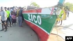 This video grab obtained by AFPTV from TVM on Apr. 8, 2024, shows the boat, that sunk off the north coast of Mozambique killing 96 people, on the Island of Mozambique. (Photo by TVM / AFP) 