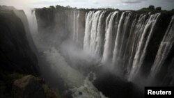 Water pours over the edge of Victoria Falls, Zimbabwe January 17, 2019. Picture taken January 17, 2019. REUTERS/Staff