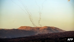 Rockets fired from southern Lebanon are intercepted near Kiryat Shmona in northern Israel on Nov. 7, 2023 amid increasing cross-border tensions between Hezbollah and Israel.