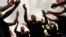 Shiite Muslims beat their chests during the Ashoura mourning ritual, in Istanbul, Turkey, July 28, 2023. 