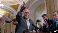 Senate Majority Leader Chuck Schumer of New York speaks to reporters after a weekly caucus meeting, at the Capitol in Washington, Sept. 19, 2023.