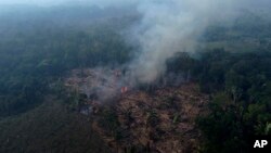 FILE - A forest burns in the Amazon in the municipality of Manaquiri in Brazil's Amazonas state, Sept. 6, 2023.