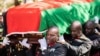 FILE - Pallbearers carry the coffin at the burial service for Malawi's Vice President Saulos Chilima in Nsipe, Malawi, June 17, 2024. 