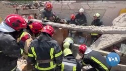 Searchers Dig for Bodies in Rubble of Lviv Apartment Complex 