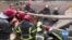 Searchers Dig for Bodies in Rubble of Lviv Apartment Complex 