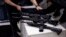 FILE - A gun owner brings in his weapons on the deadline given by Brazil's government for gun registration with the National Weapons System of the Federal Police, in Rio de Janeiro, Brazil, April 3, 2023.