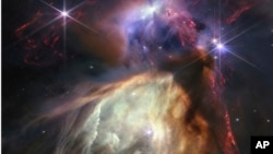 NASA's James Webb Space Telescope displays a star birth, full of detailed, impressionistic texture, in this image released July 12, 2023, by Space Telescope Science Institute Office of Public Outreach. The subject is the Rho Ophiuchi cloud complex. 