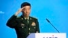 FILE - Chinese Defense Minister Li Shangfu salutes as he arrives to deliver his speech in Moscow, Russia, Aug. 15, 2023.