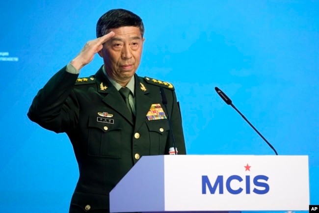 FILE - Chinese Defense Minister Li Shangfu salutes as he arrives to deliver his speech in Moscow, Russia, Aug. 15, 2023. Li has not been seen in public since August 25.