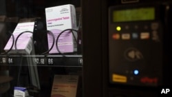 FILE - A vending machine is stocked with emergency contraceptives at Odegaard Library on the campus of the University of Washington, June 2, 2023, in Seattle. 