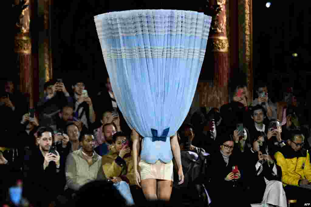 A model presents a creation for Viktor & Rolf during the Haute-Couture Spring-Summer 2023 Fashion Week in Paris, France, Jan. 25, 2023.