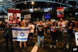 Family members and friends of around 240 hostages held by Hamas in Gaza urge Israeli Prime Minister Benjamin Netanyahu to immediately take them home, during a demonstration in Tel Aviv, Israel, November 21, 2023.