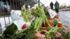 FILE - Flowers sit near the site of a deadly shooting at a Kingdom Hall of Jehovah's Witnesses in Hamburg, Germany, March 11, 2023. Members held a memorial service Saturday for the six people killed in the shooting.