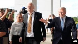WikiLeaks founder Julian Assange, center, arrives at the United States courthouse where he is expected enter a plea deal in Saipan, Mariana Islands, June 26, 2024. 