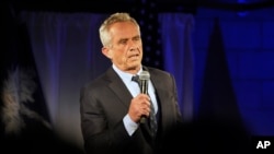 FILE - Former presidential candidate Robert F. Kennedy Jr. speaks during a campaign event in Columbia, S.C., Nov. 14, 2023. He has since left the race, saying he wants voters who would have backed him to vote for the Republican nominee, former President Donald Trump.