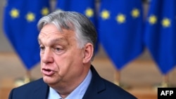 Hungary's Prime Minister Viktor Orban talks to journalists ahead of the European Council Summit at the EU headquarters in Brussels, Belgium, June 27, 2024. 