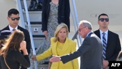 US first lady Jill Biden (C) is welcomed as she arrives to celebrate the US rejoining UNESCO, at the Orly Airport in Orly, Paris' suburb, on July 24, 2023. 