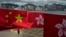 FILE - Chinese and Hong Kong flags mark the 25th anniversary of Hong Kong handover to China, in Hong Kong on June 17, 2022.