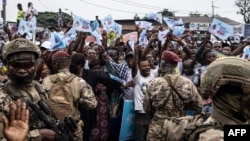 wafuasi wa Felix Tshisekedi wakishangilia katika mkutano wa kampeni huko Kinshasa Desemba 18,2023. Picha na JOHN WESSELS / AFP. 