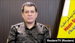This image taken from a video shows the head of the Syrian Democratic Forces, General Mazloum Abdi, as he speaks from northeast Syria during an interview on Zoom with Reuters in Beirut, Lebanon, Feb. 7, 2024, (Reuters TV via Reuters)