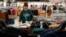 An employee straightens displays at a Kohl's store in Clifton, N.J., Jan. 26, 2024. 
