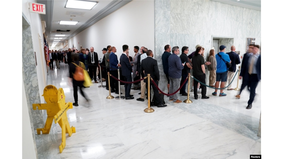 People wait in line to try to enter a hearing on unidentified anomalous phenomena on Capitol Hill in Washington, July 26, 2023.