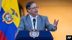 FILE - Colombian President Gustavo Petro speaks to supporters outside the presidential palace in Bogota, Colombia, Feb. 13, 2023. Tens of thousands of Colombians marched Sunday to reject Petro's proposed economic and social reforms.