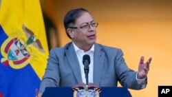 FILE - Colombian President Gustavo Petro speaks to supporters outside the presidential palace in Bogota, Colombia, Feb. 13, 2023.