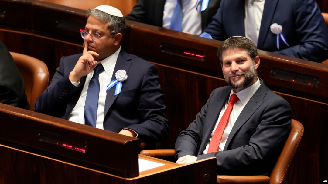 FILE - Israeli right wing Knesset member Itamar Ben Gvir, left, and Bezalel Smotrich look on during the swearing-in ceremony for Israeli lawmakers at the Knesset, Israel's parliament, in Jerusalem, Nov. 15, 2022.