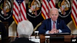 President Joe Biden attends a meeting with the President's Council of Advisors on Science and Technology in the State Dining Room of the White House, April 4, 2023, in Washington.