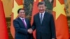 FILE - Vietnam's Prime Minister Pham Minh Chinh , left, shakes hands with Chinese President Xi Jinping before their meeting in Beijing, June 27, 2023. Xi is expected to pay a state visit to Vietnam this week.