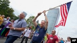 U.S. Ambassador Mark Brzezinski marches in the yearly pride parade in Warsaw, Poland, June 17, 2023. The ambassador was sending a clear message of Washington's opposition to discrimination against LGBTQ+ people.