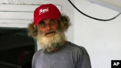 Australian Timothy Lyndsay Shaddock looks out from the tuna boat "Maria Delia" that rescued him and his dog Bella, as he arrives to port in Manzanillo, Mexico, July 18, 2023. 