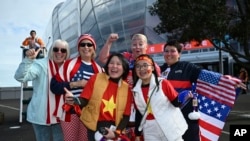 Soccer fans pose for photos before the start of the Women's World Cup Group E soccer match between the United States and Vietnam at Eden Park in Auckland, New Zealand, July 22, 2023. 