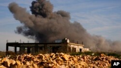 Black smoke rises from an Israeli airstrike on the outskirts of Yaroun, a Lebanese border village with Israel, in southern Lebanon, Dec. 10, 2023.