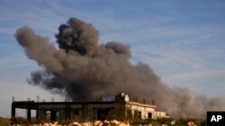 FILE - Black smoke rises from an Israeli airstrike on the outskirts of Yaroun, a Lebanese border village with Israel, in southern Lebanon, Dec. 10, 2023.