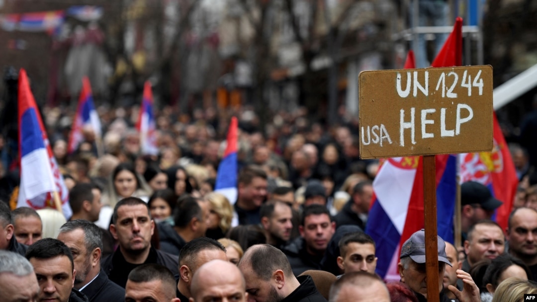 Kosovo Serbs gather as they take part in a protest to oppose the decision by the Central Bank of Kosovo that announced the euro as the only legal currency that can be used in cash operations, in Mitrovica, Feb. 12, 2024.