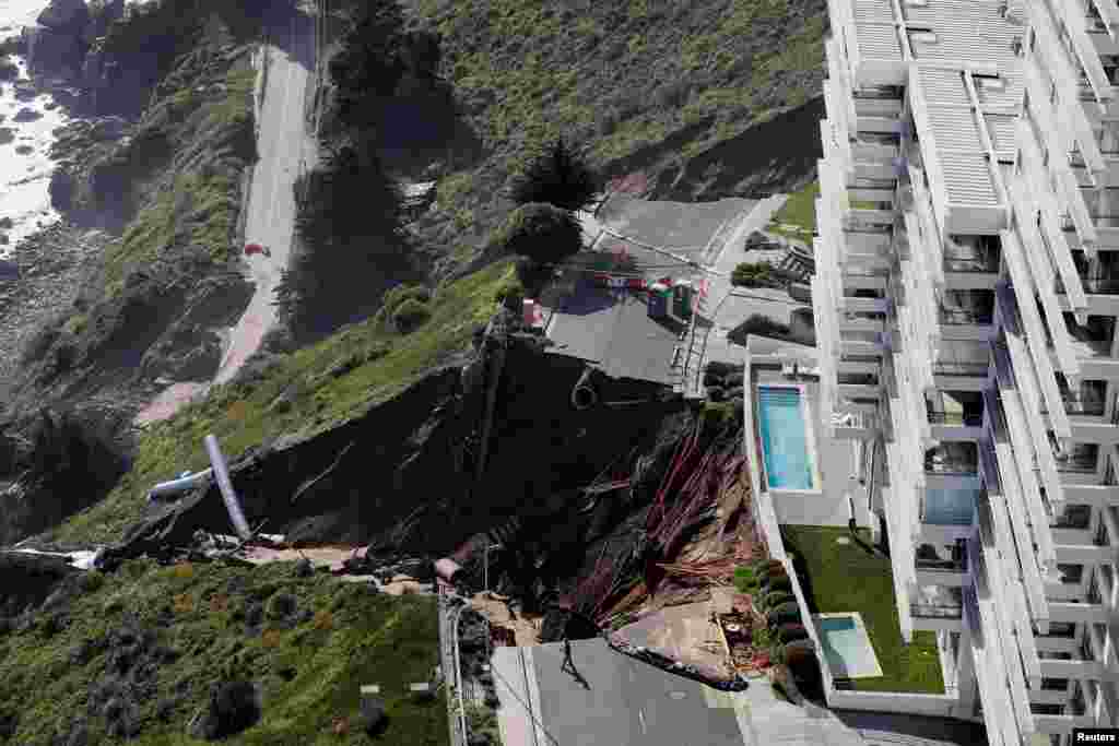 View of a massive landslide next to a building complex, after heavy rains hit Concon, Chile, Sept. 11, 2023. REUTERS/Rodrigo Garrido