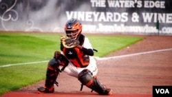 Dennis Kasumba practices catching during his second game with the Frederick Keys Baseball team at Harry Grove Stadium in Frederick, Maryland on June 3, 2023. (Arzouma Kompaore/VOA)