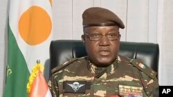 In this image taken from video provided by ORTN, Gen. Abdourahamane Tchiani makes a statement, July 28, 2023, in Niamey, Niger.