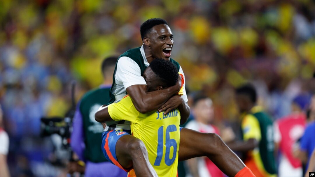 Colombia's Jefferson Lerma (16) and a teammate celebrate their team's 1-0 victory over Uruguay at the end of a Copa America semifinal soccer match in Charlotte, NC, July 10, 2024. 