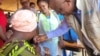 UNICEF representative in Malawi Shadrack Omol giving polio vaccine to a child in Chiradzulu district in Malawi on Sept. 12, 2023.