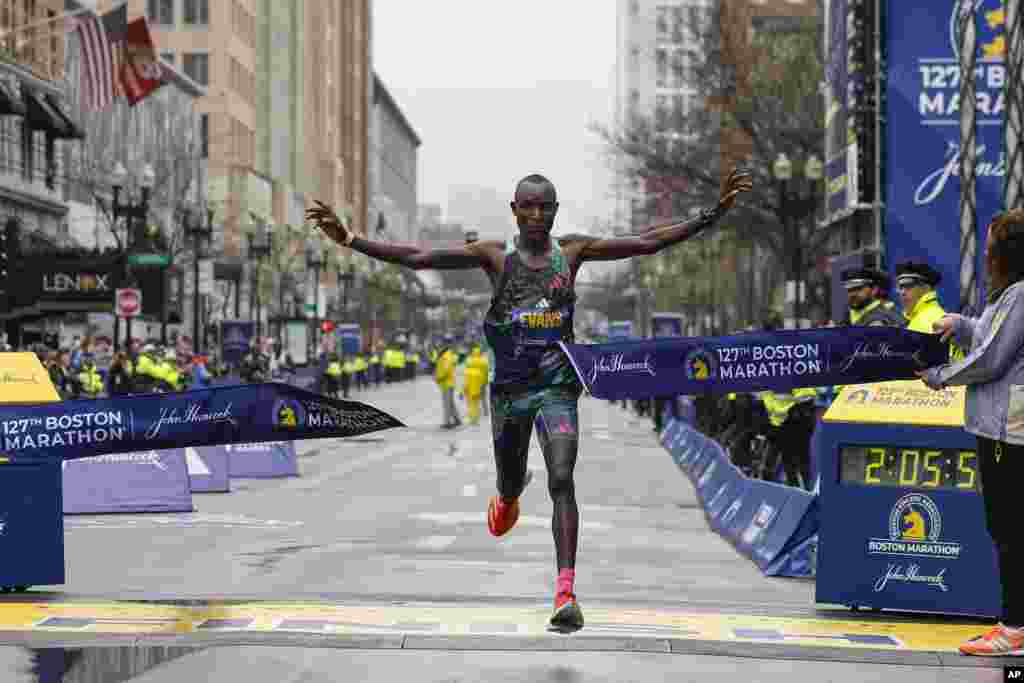 Evans Chebet of Kenya breaks the tape to win the 127th Boston Marathon, in Boston, Massachusetts.