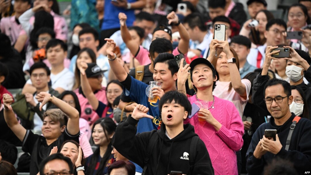Fans react after not seeing Inter Miami's Argentine forward Lionel Messi play in the friendly football match between Hong Kong XI and U.S. Inter Miami CF in Hong Kong, Feb. 4, 2024.