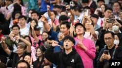 Fans react after not seeing Inter Miami's Argentine forward Lionel Messi play in the friendly football match between Hong Kong XI and U.S. Inter Miami CF in Hong Kong, Feb. 4, 2024.